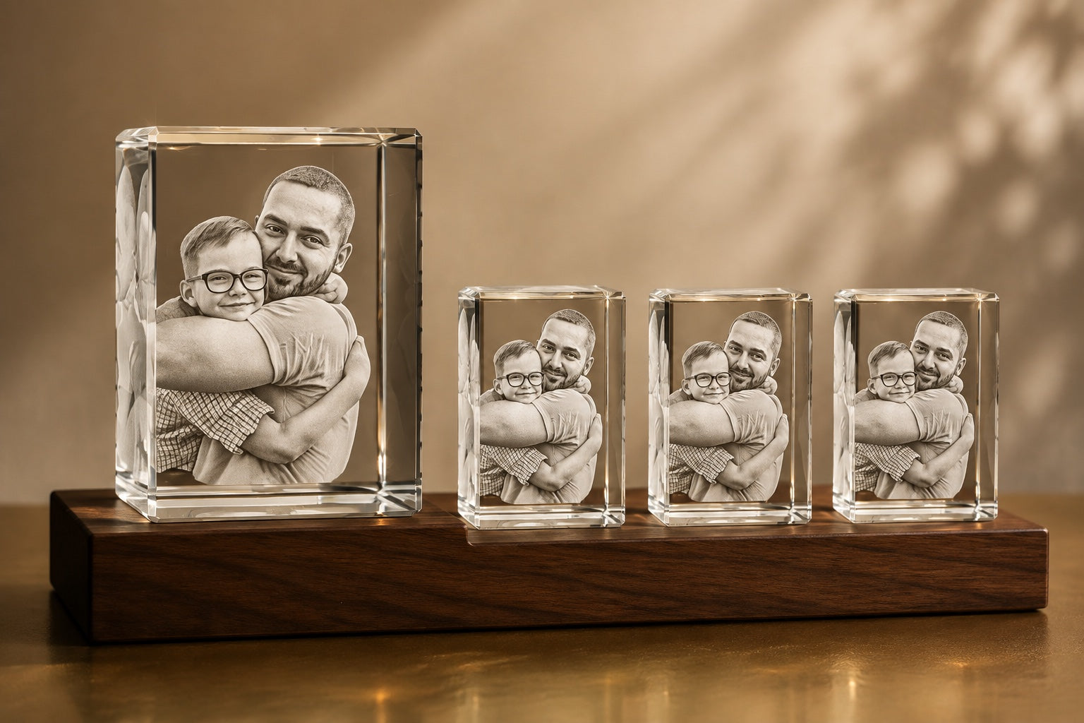 One large crystal portrait with three smaller matching copies