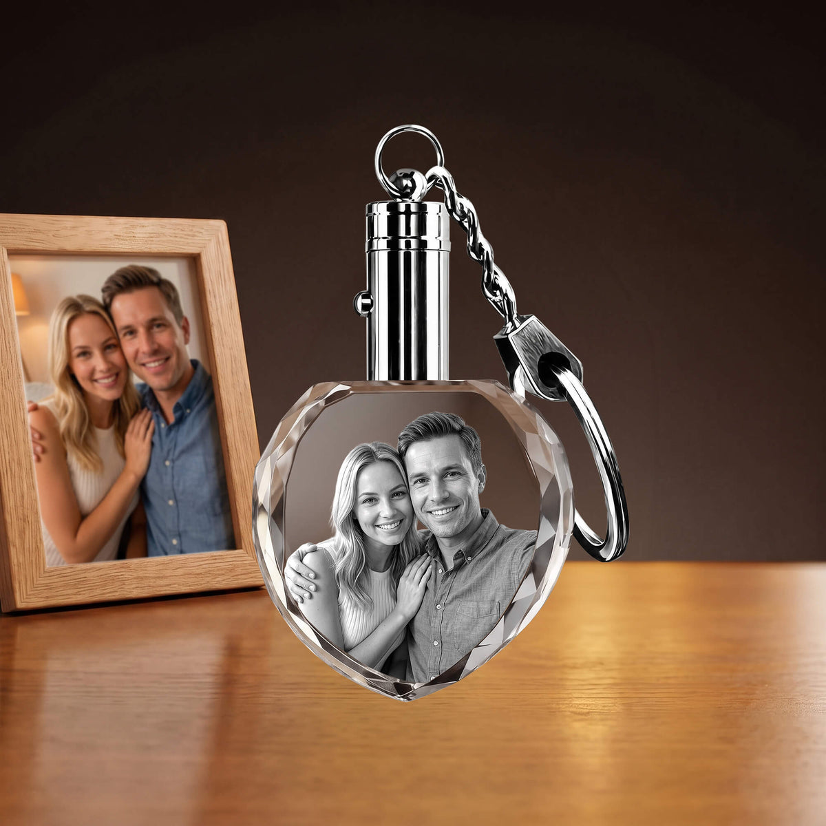 Heart-shaped crystal keychain with a couple's portrait.