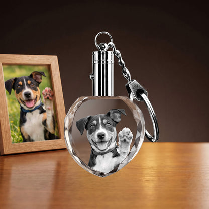 Heart-shaped crystal keychain with a dog's portrait.