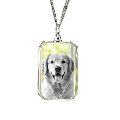 Rectangular crystal necklace with a dog portrait on a light background.