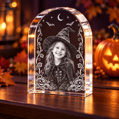 3D Crystal Arch Halloween Photo Gift in a pumpkin and amber-light Halloween setting, alternate view
